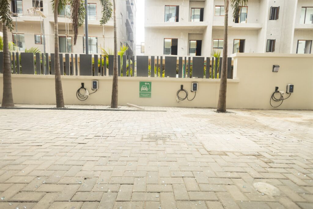 Brum Height 7: Paved forecourt with a row of electric vehicle chargers